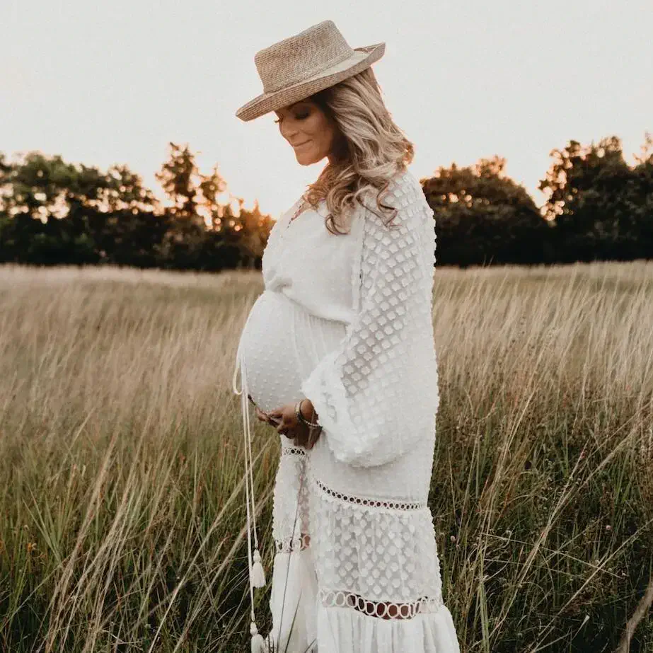 Pregnant lady in a field, springtime