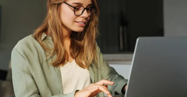 Woman looking at laptop