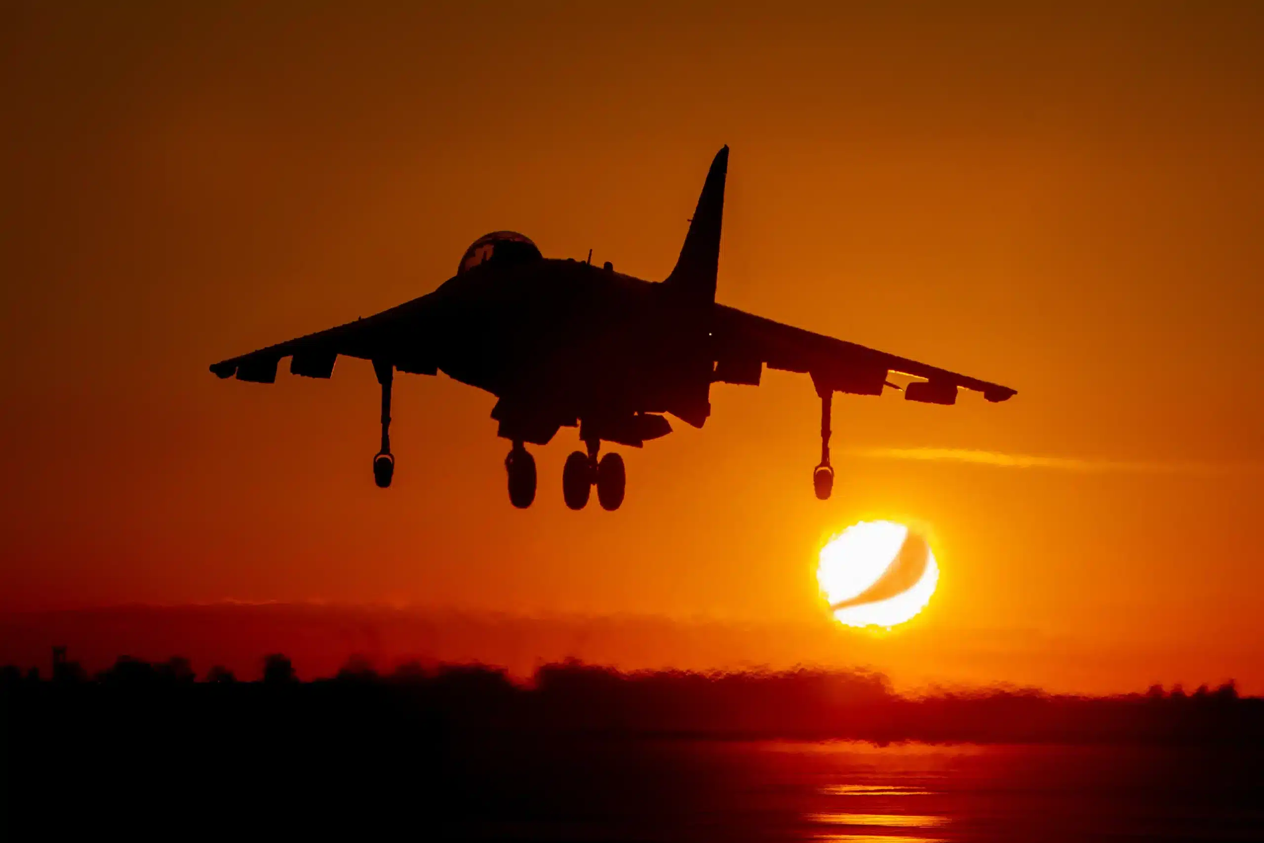 A jet taking off at sunset